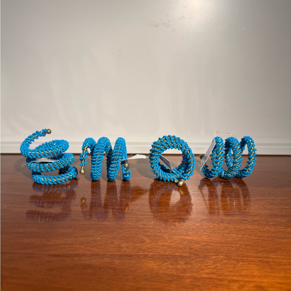 Blue wrapped beaded napkin rings. Set of 4.